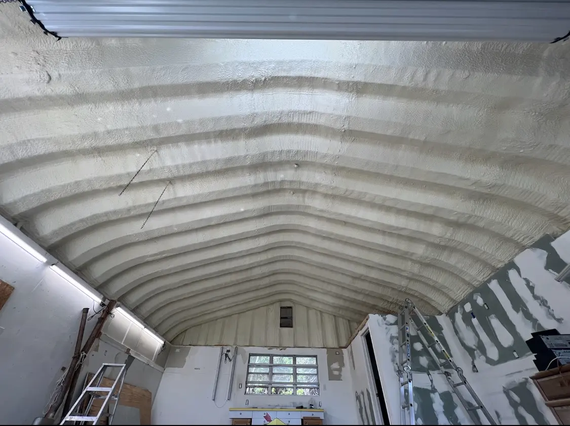 Spray polyurethane foam applied to the underside of a metal roof deck in Plainville